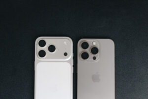 iPhone 17 Pro and 15 Pro lying next to each other on dark background